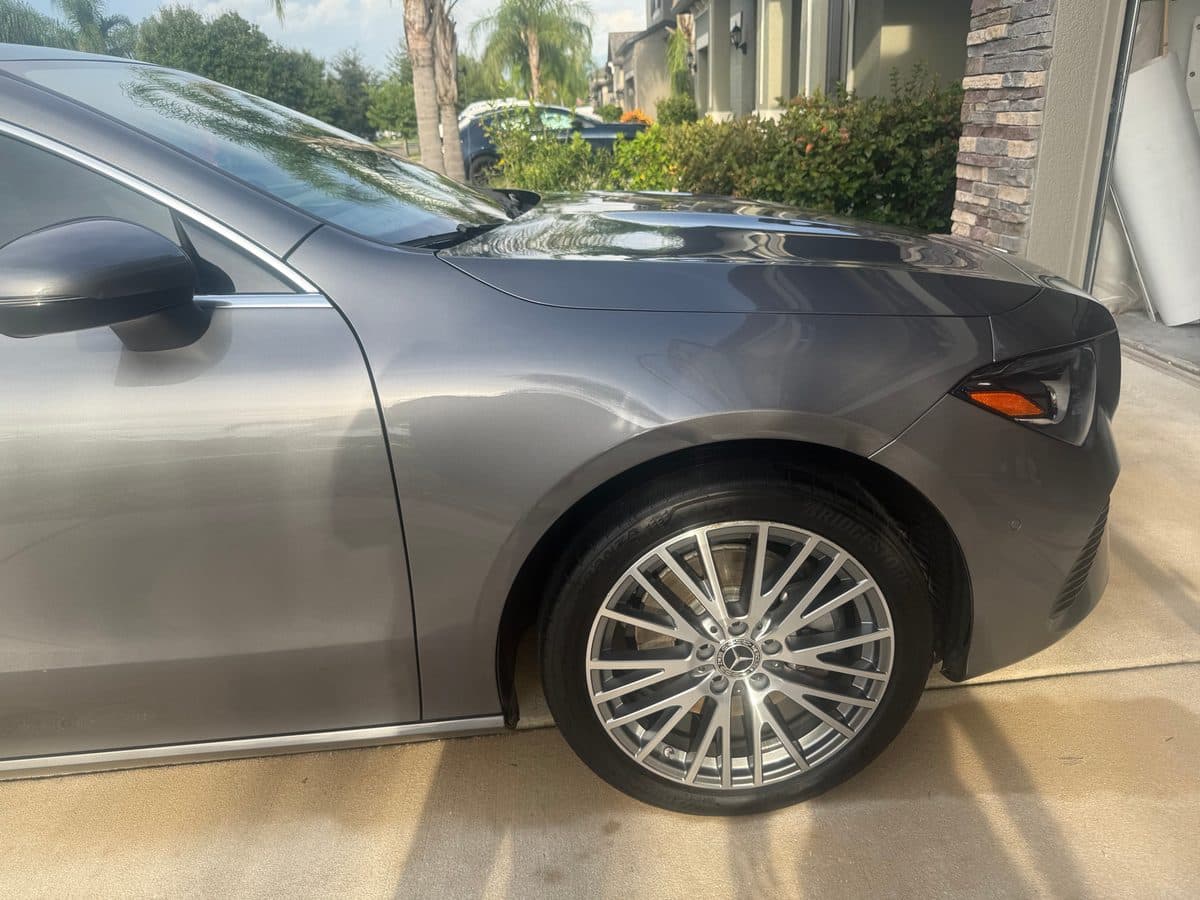 Detailed grey Mercedes-Benz CLA front fender and wheel
