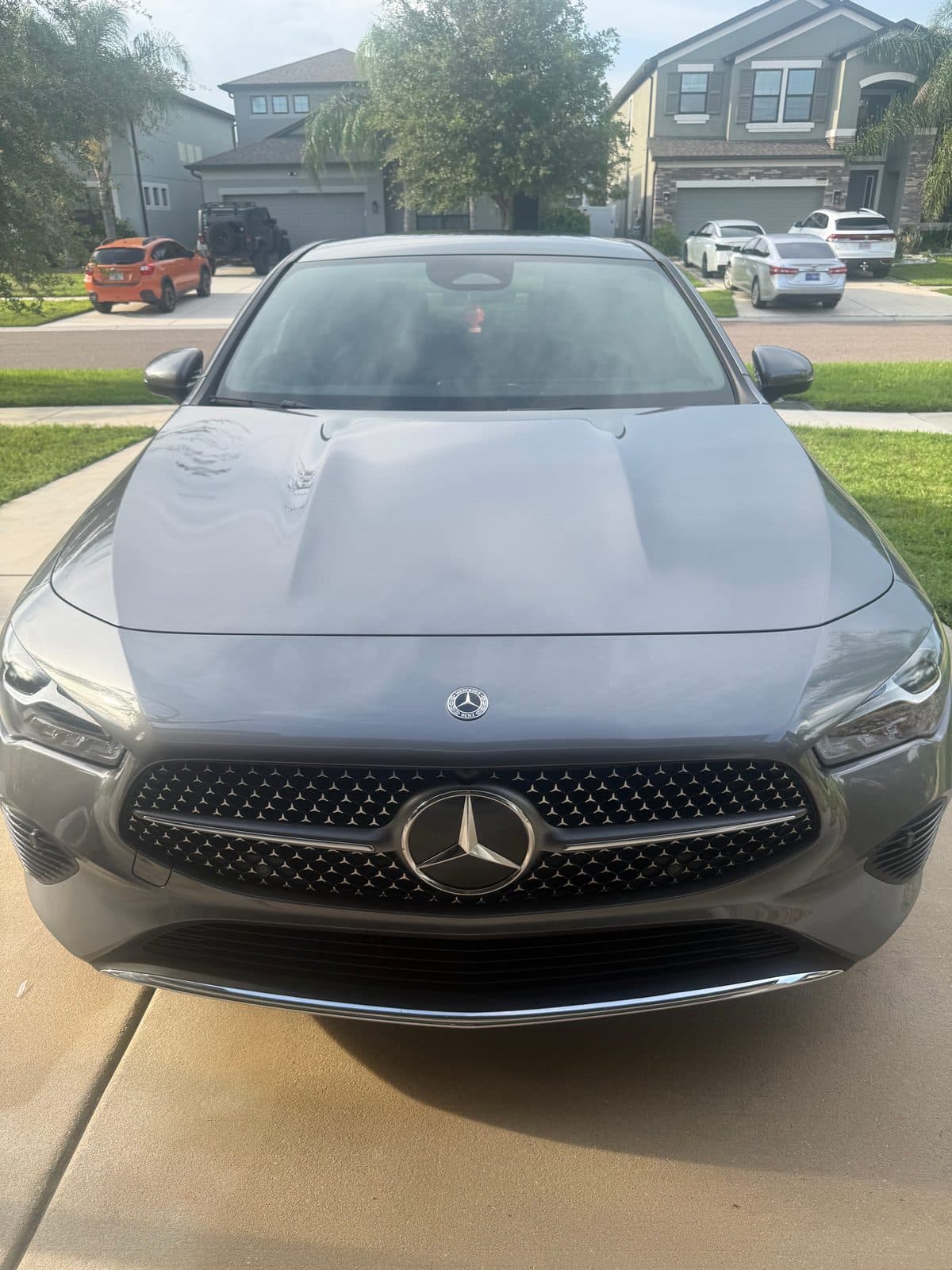 Freshly detailed grey Mercedes-Benz CLA, glossy front end